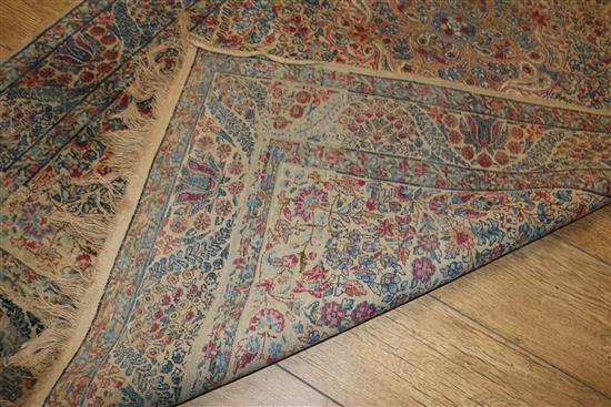 A Caucasian rug with triple medallion on a blue ground and two worn Persian rugs 210 x 120cm, 205 x 135cm and 195 x 145cm